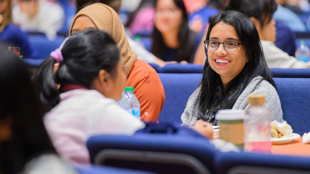 students sitting together at a dinner